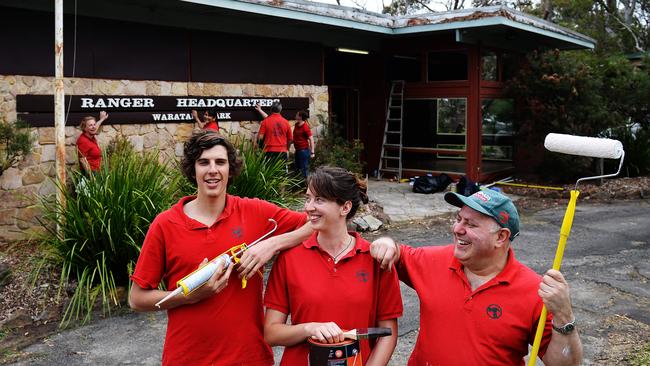 Pictured from left, Bunnings staff James Zimbulis, Sylvie Ashford, and Joe Micali work on helping restore the “Waratah Park” set in 2014. Picture: Braden Fastier