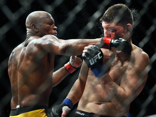 Anderson Silva lands a punch to the face of Nick Diaz.