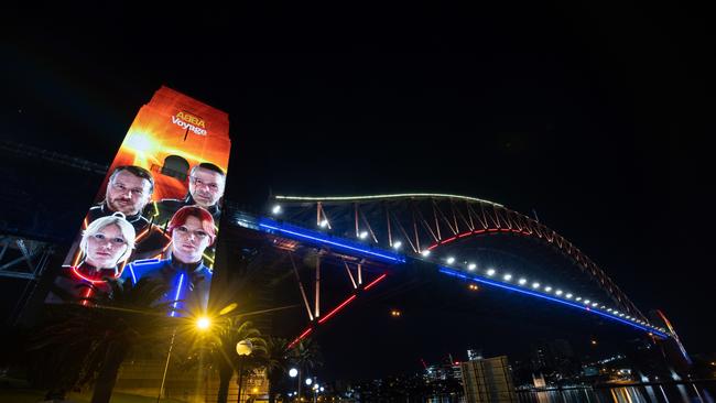 The avatars of Benny, Bjorn Agnetha and Anni-Frida illuminate the pylons of the Sydney Harbour Bridge accompanied by a dazzling light display across the Bridge arch.