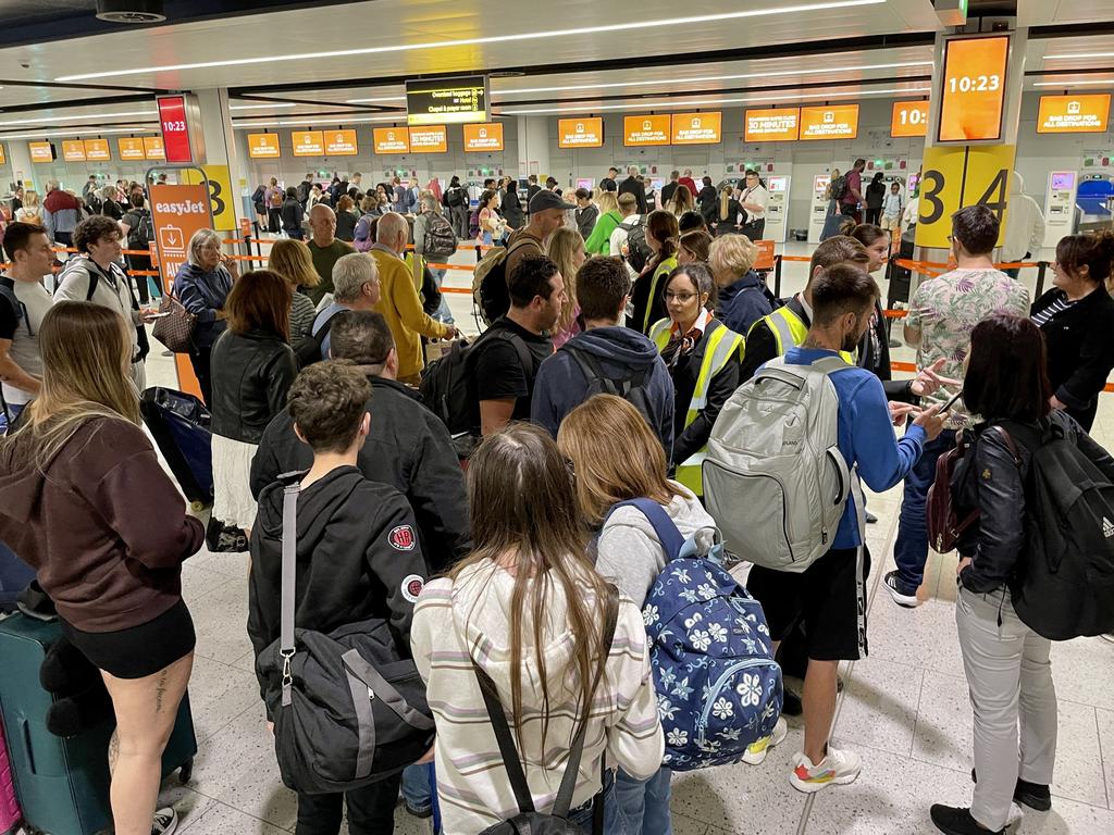 Passengers facing massive queues at Manchester Airport this morning. Picture: Mega Agency]
