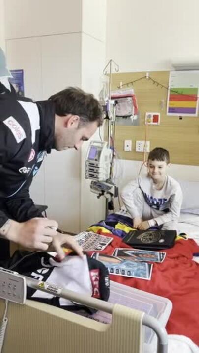 Port Adelaide players visit sick kids at the Women's and Children's Hospital