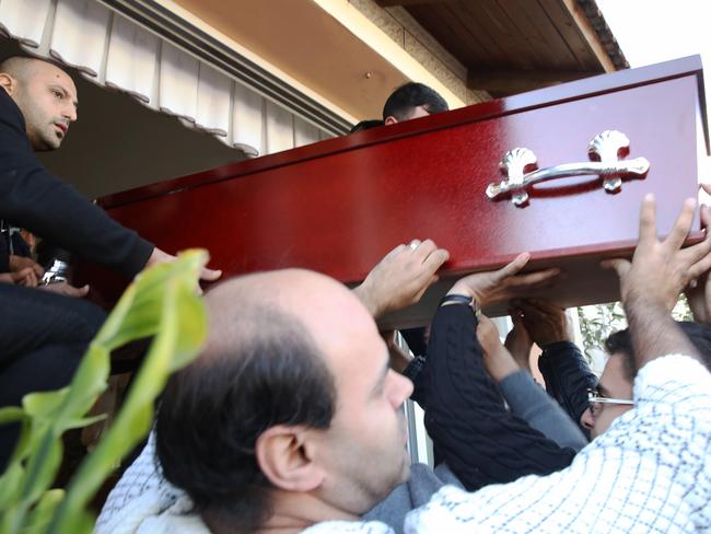 Aiia Maasarwe’s coffin is carried from the family home. Picture: Ella Pellegrini