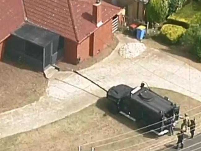 Police negotiated with a 22-year-old man for several hours before arresting him just before 7pm. Picture: 7 News