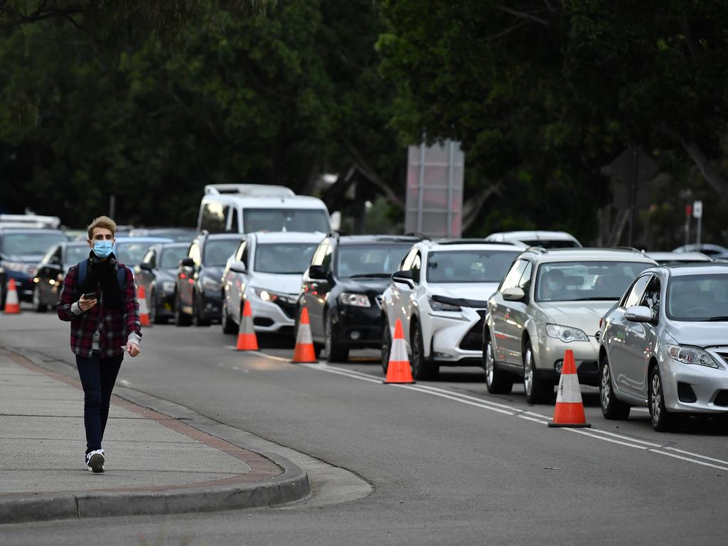 People responded to new rules requiring them to get tested every three days if they leave the Fairfield LGA – with testing queues quickly stretching back kilometres. Picture: NCA NewsWire/Joel Carrett