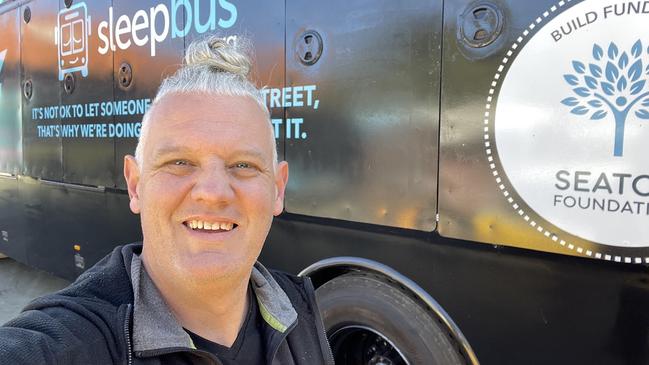 sleepbus founder Simon Rowe with one of the charity's buses. Picture: Contributed.