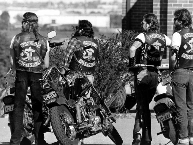 Gang members look on at the funeral of two Bandidos bikie gang members.