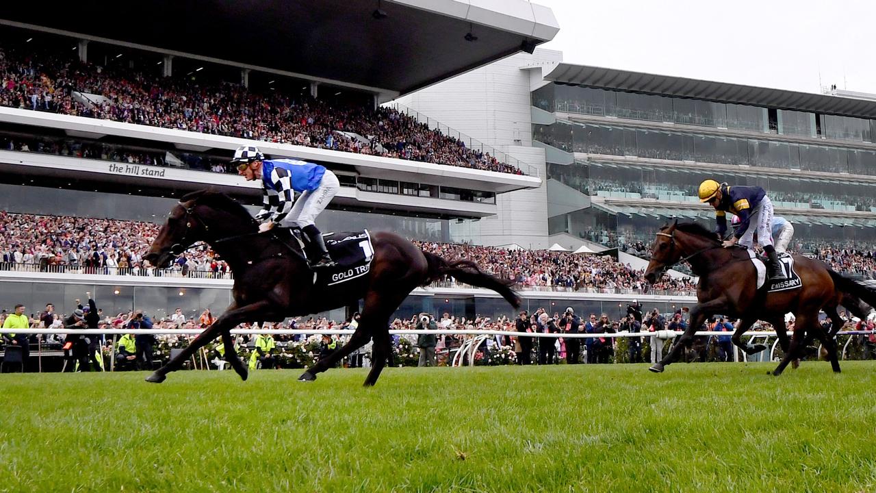 Gold Trip, ridden by Mark Zahra, crosses the line to win the Melbourne Cup. Photo by William WEST / AFP
