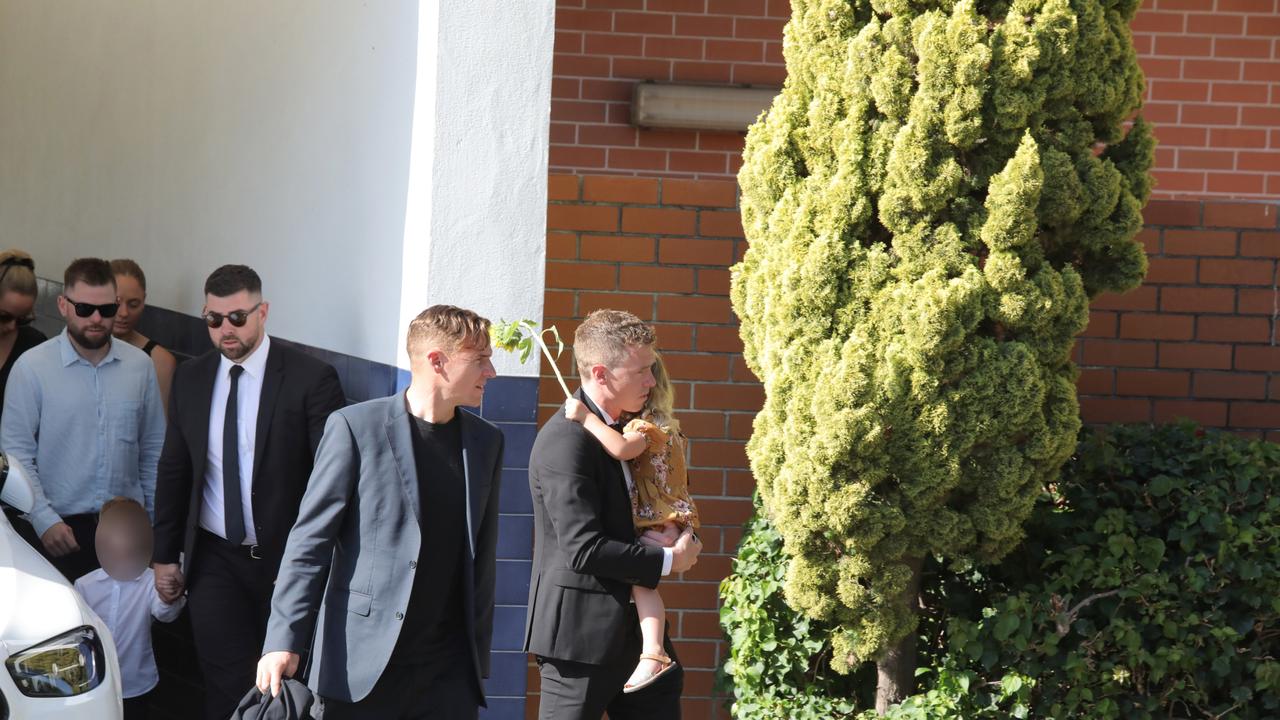 Rohan Dennis is pictures with his daughter, and son behind, as he leaves the funeral of Melissa Hoskins. Picture: NCA NewsWIRE/Philip Gostelow