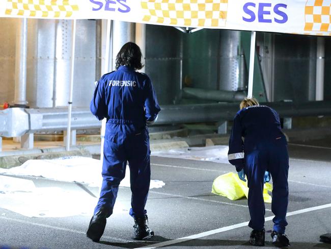 Forensic officers examine the scene. Photo: Patrick Herve