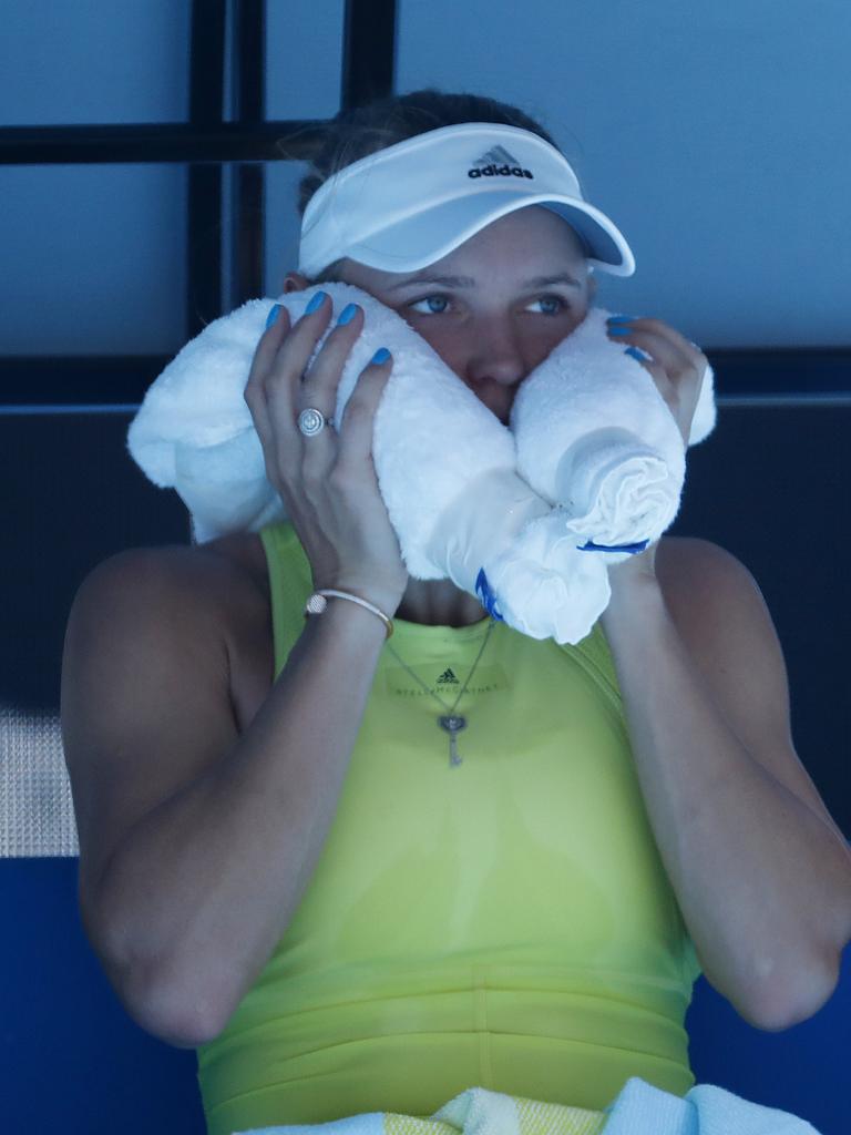 Wozniacki using ice between game to stay cool during her 2nd round match .Pic: Michael Klein