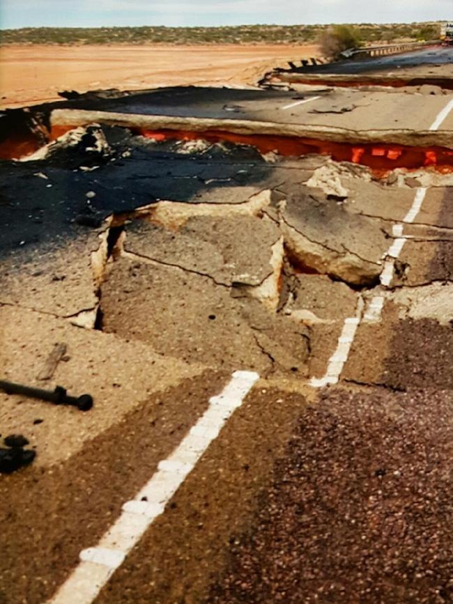 The damaged bridge on the Stuart Highway where a truck and car collided and burst into flames. Picture: SA Police