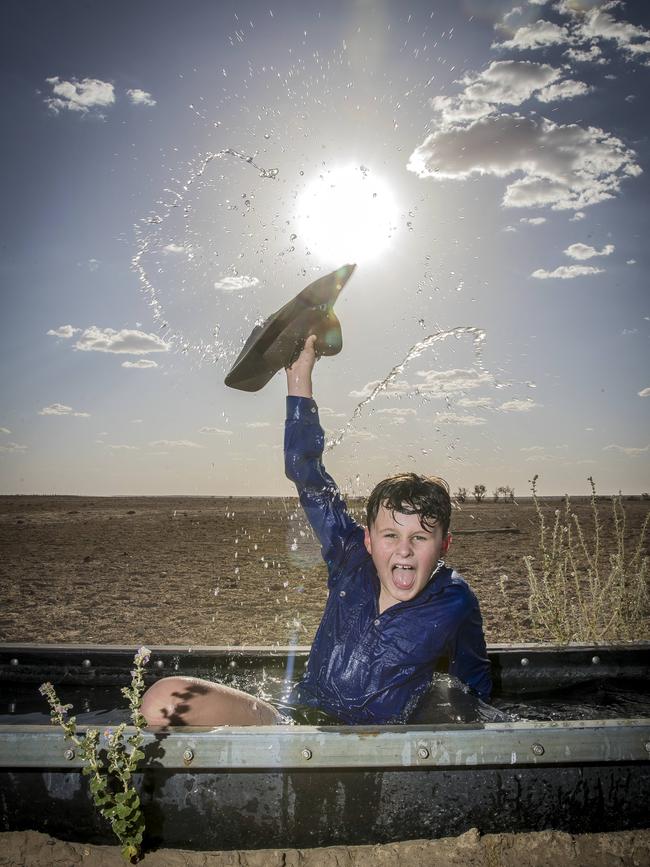 Charles Carstairs, 9, keeping cool during a 46C afternoon in Birdsville. Picture: Peter Wallis