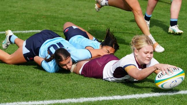 What a try. QLD White under 16s captain Poppy Gibbons reaches out to score at the 2024 Australian Schools Rugby Championships. Picture: Anthony Edgar.