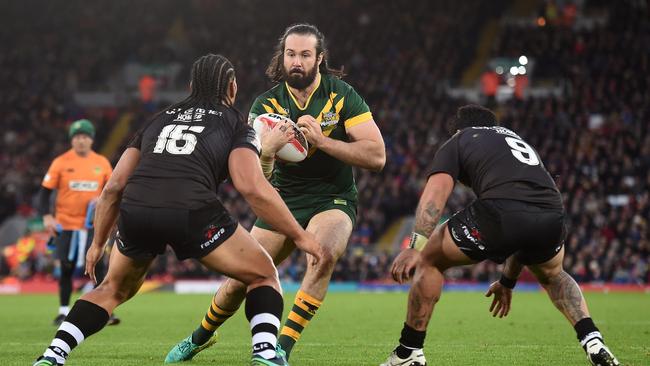 Australia's prop Aaron Woods vies with New Zealand's Martin Taupau and New Zealand's hooker Issac Luke.