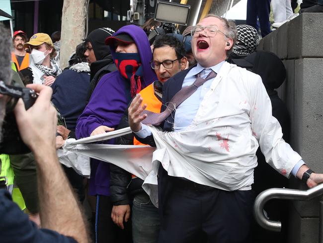 Protesters surround the Melbourne Convention centre in an attempt to close down The Land Forces 2024 International Land Defence Exposition. A jewish supporter is attacked by the protesters. Wednesday, September 11. 2024. Picture: David Crosling