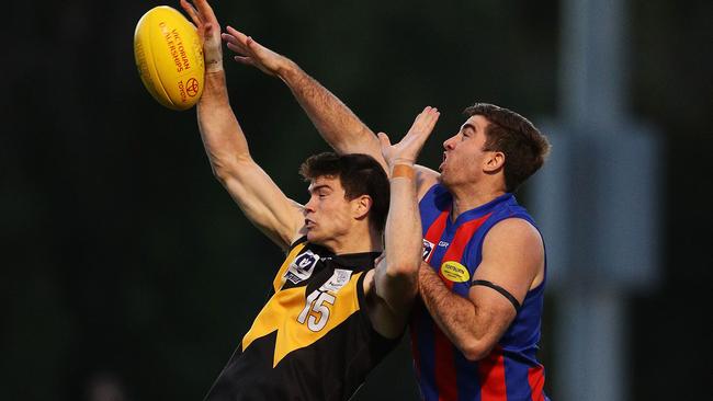 Sam Collins battles Jordan Lisle in the VFL.