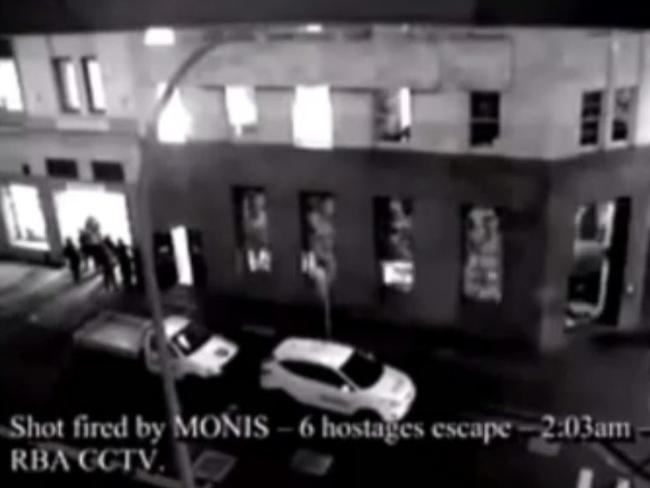 CCTV footage showing Man Haron Monis shooting at 6 Hostages as they escape the Lindt Cafe in Martin Place at 2:03am