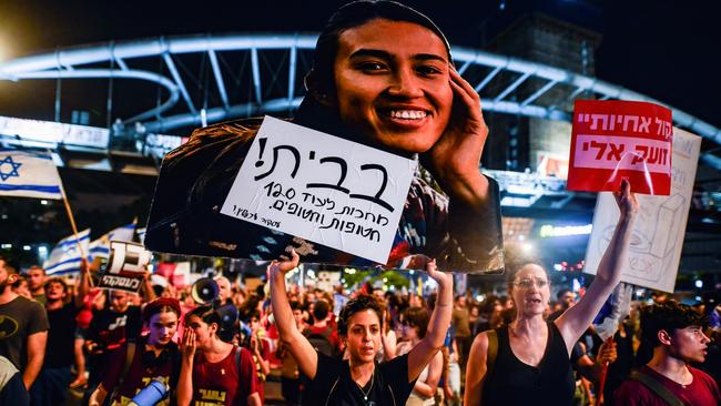 Women protesters inTel Aviv hold a placard with the photo of rescued Israeli female hostage Noa Argamani that says: 'At home! We wait for another 120 hostages. Hostage Deal Now'. Picture: Matan Golan/SOPA Images/LightRocket via Getty Images.