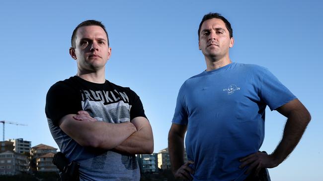 Detective Sergeant Michael Marinello, left, and Senior Probationary Constable John Cudmore are on the front line in the crackdown on domestic violence repeat offenders. Picture: Toby Zerna