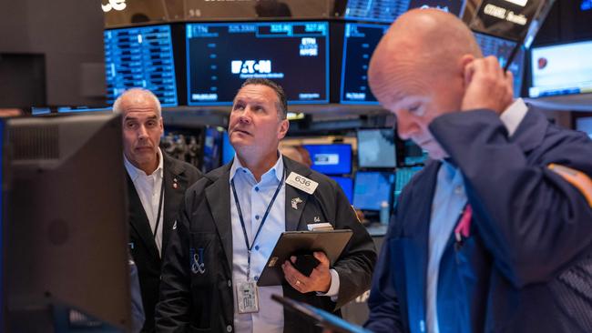 Traders work on the floor of the New York Stock Exchange. Barclays warns that election uncertainty has started to weigh on the outlook for Europe and the US. Picture: Getty Images
