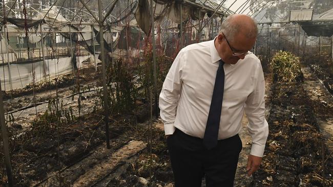 Scott Morrison tours bushfire damage yesterday. Picture: AP