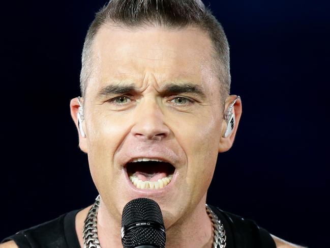 Robbie Williams on stage during his Heavy Entertainment Show World Tour concert at Qudos Bank Arena, Sydney Olympic Park. Picture: Jonathan Ng**photos are one time use only**