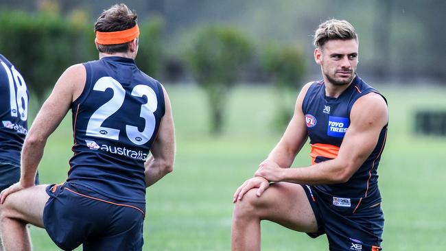 Stephen Coniglio, right, scored 129 SuperCoach points in the opening round.