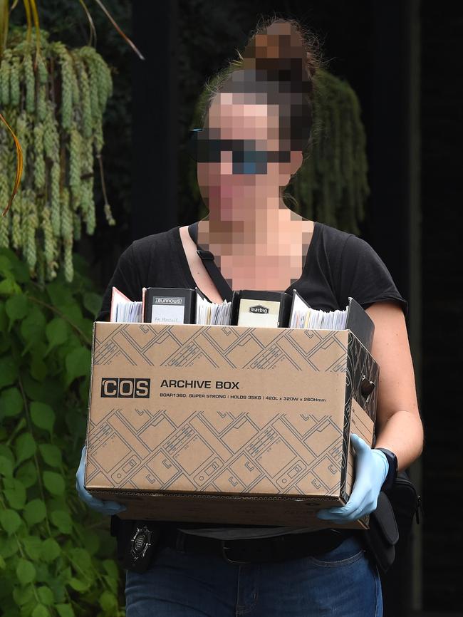 An IBAC officer takes evidence from a property in Kelior East. Picture: Nicole Garmston