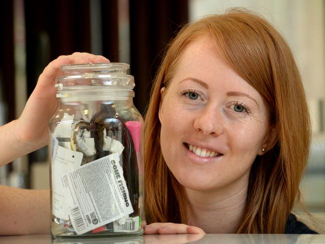 Erin Rhoads with a jar of all the rubbish she has generated in 18 months that can’t be recycled. Picture: Kylie Else