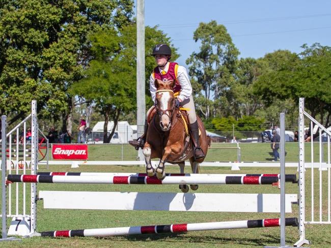 Marley Barritt clears the oxer at the 2023 PQC State Showjumping Championships.