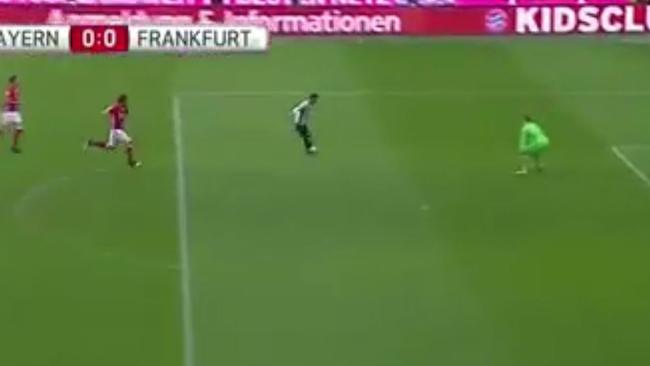 Mats Hummels tackles a Frankfurt player.