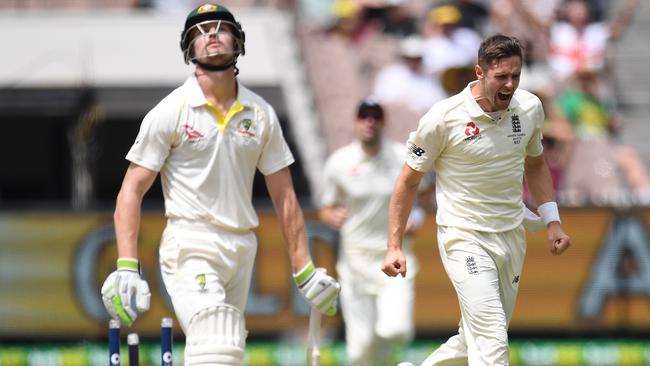 Cameron Bancroft, left, reacts after being bowled out by Chris Woakes. Picture: AAP.