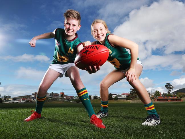 Tasmania Devils players Oliver Cunningham, 12. of New Town, and Claire Ransom, 15, of Mount Stuart, are excited that Tasmania has reached the 50,000 pledge target. Picture: ZAK SIMMONDS