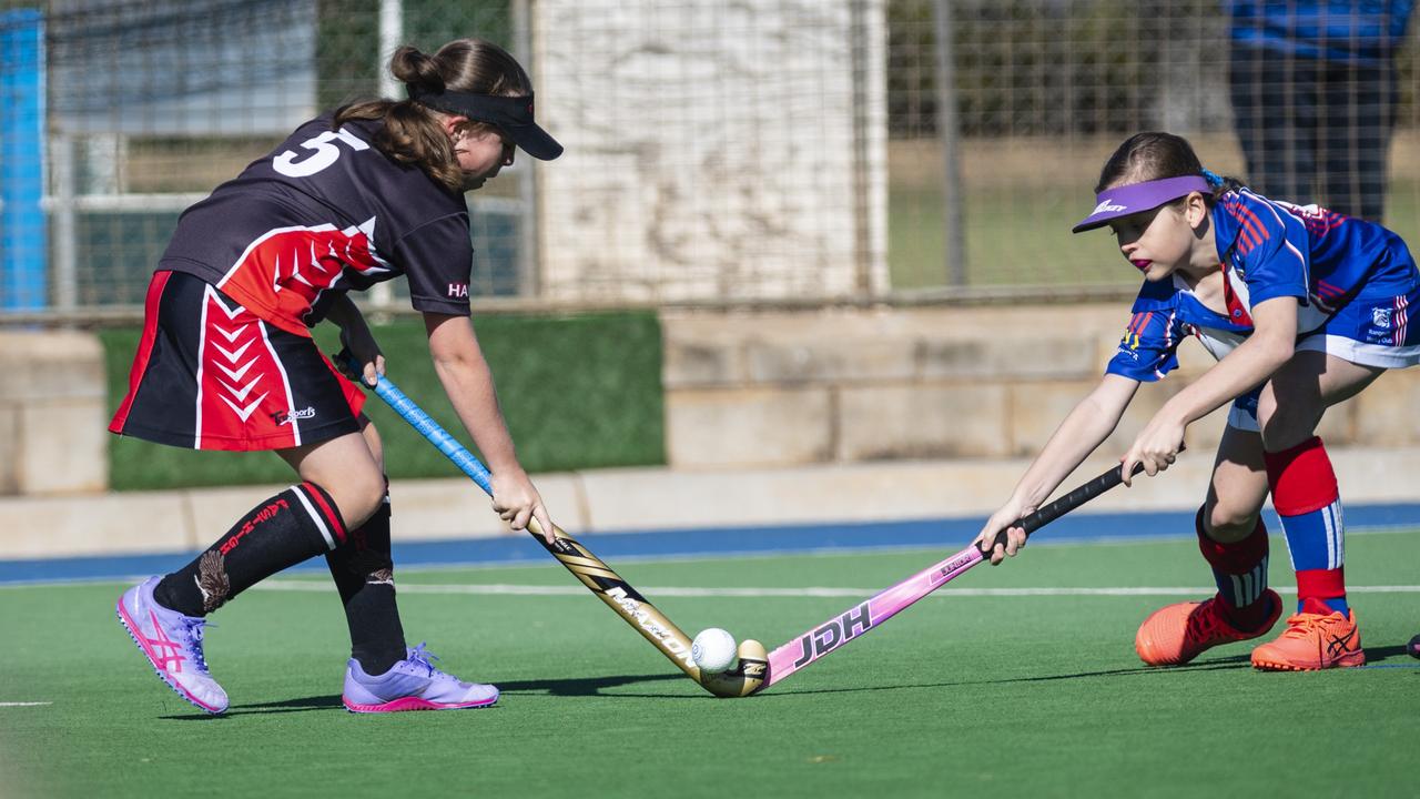 Mikayla Brasher (left) of Past High against Isla Fea of Rangeville in under-11 girls Presidents Cup hockey at Clyde Park, Saturday, May 27, 2023. Picture: Kevin Farmer