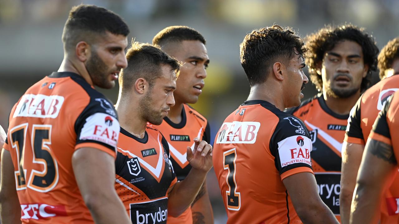 Wests Tigers players show their dejection after a try. Picture: NRL Photos