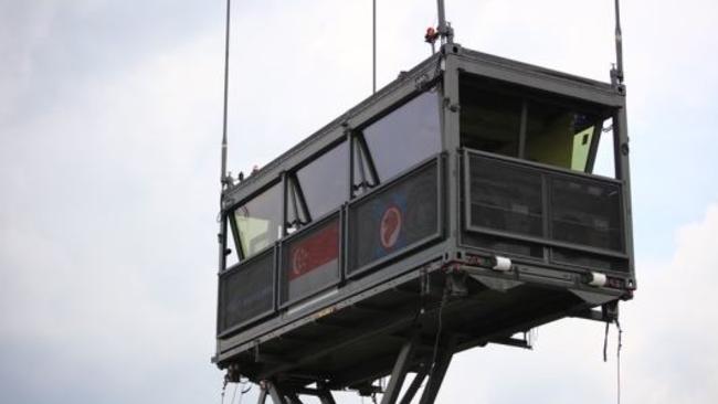 A mobile air traffic control tower in Singapore wheeled in on a truck.