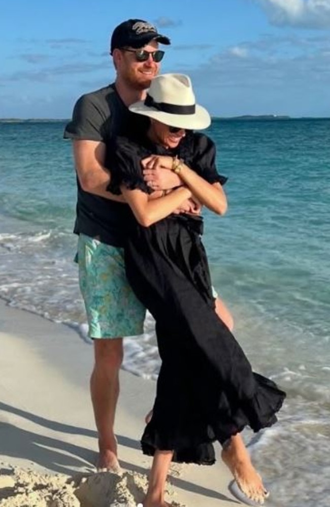 Meghan also shared this sweet photo of Prince Harry embracing her during a stroll on the beach. Picture: Instagram