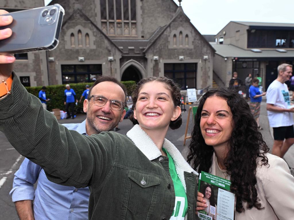 Federal Greens leader Adam Bandt with Greens volunteer Carmena Witham and Greens candidate Angelica Di Camillo at the Fawkner Park booth. Picture: Josie Hayden