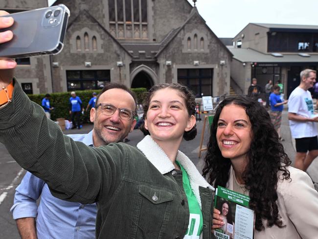 Federal Greens leader Adam Bandt with Greens volunteer Carmena Witham and Greens candidate Angelica Di Camillo at the Fawkner Park booth. Picture: Josie Hayden