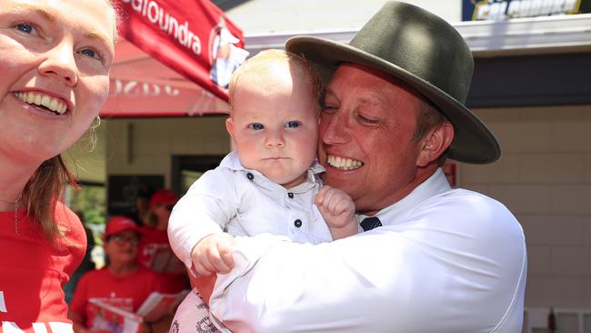 Premier Steven Miles visits pre polling at the Caloundra Cricket Club on the Sunshine Coast where he met six-month-old Seamus Fouhy. Picture: Adam Head