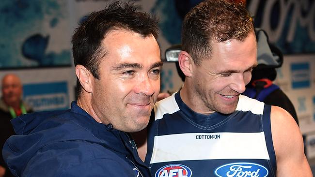 Chris Scott, with skipper Joel Selwood, has committed to the Cats until 2022. Picture: AAP