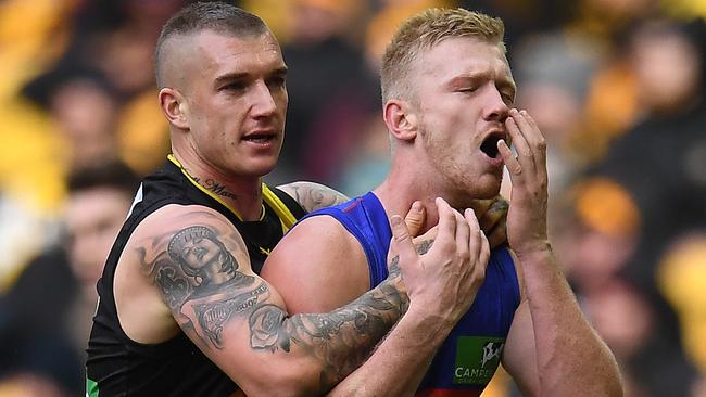 Dustin Martin clashes with Nick Robertson at Etihad Stadium. Picture: AAP