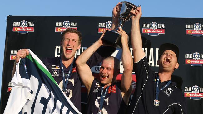 Nathan O'Keefe, Mark Cecere and Kane Shaw celebrate Seville’s premiership win. Picture: Stuart Milligan