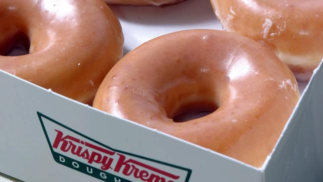 Glazed Krispy Kreme doughnuts will soon be in Cairns as 7-Eleven launches a $15m bid to take the region by storm. Photo: AP Photo