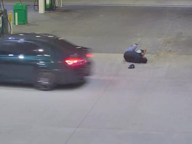 A still from the CCTV footage of victim Shann Chain lying on the floor after being dragged alongside the car and flung into the air by Kazem Elarja.