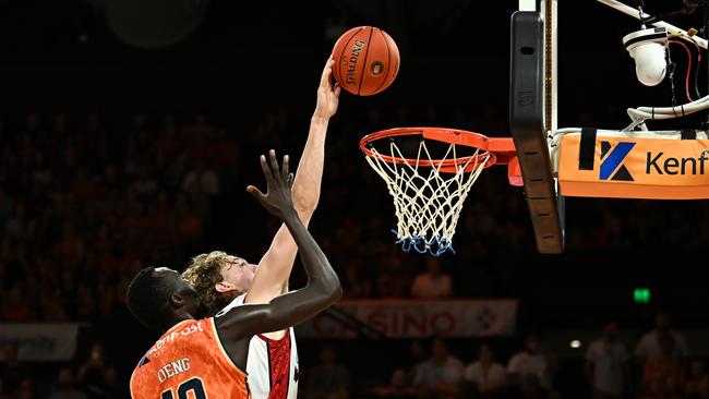 Luke Travers of the Wildcats defends the basket during the round two NBL match between Cairns Taipans and Perth Wildcats at Cairns Convention Centre, on October 10, 2022, in Cairns, Australia. Picture: Emily Barker/Getty Images