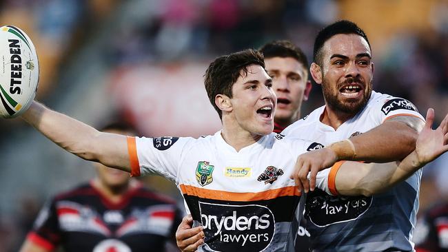 Mitchell Moses celebrates after scoring a try.