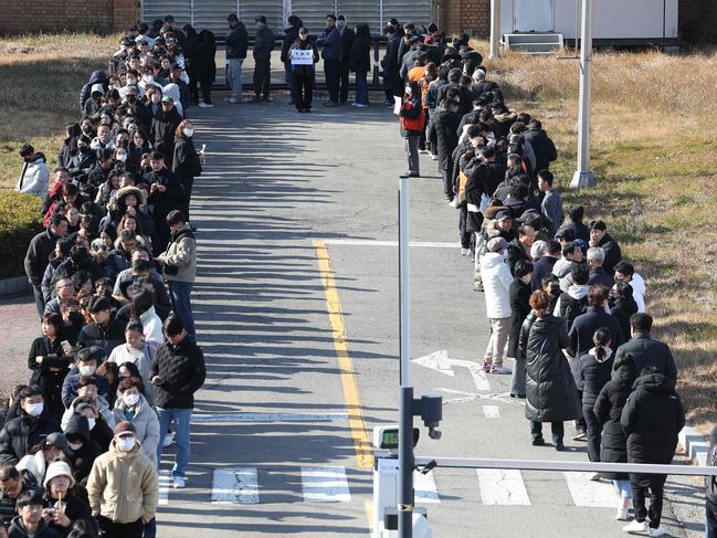 Mourners wait to pay their respects. Picture: AFP