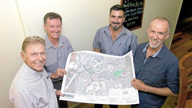 Graham Marsh, Jonathan Mann, Jason Sullivan and Michael Mann with plans for the Station Creek Lifestyle Village. Picture: Jon Ortlieb