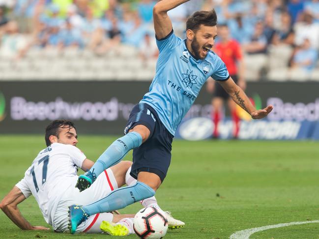 Milos Ninkovic of Sydney FC fouled by Adelaide's Nikola Mileusnic resulting in a free kick during the Round 13 A-League match between the Sydney FC and the Adelaide United at Jubilee Stadium in Sydney, Sunday, January 13, 2019. (AAP Image/Steve Christo) NO ARCHIVING, EDITORIAL USE ONLY